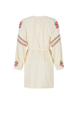 an-off-white-long-sleeve-mini-dress-with-colorful-floral-and-geometric-embroidery-on-the-sleeves-and-neckline-shown-against-a-plain-white-background