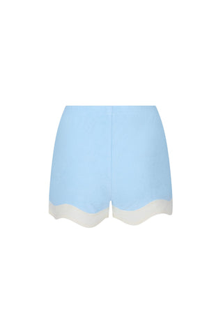 Light blue shorts with a contrasting off-white scalloped hem, shown flat against a white background.