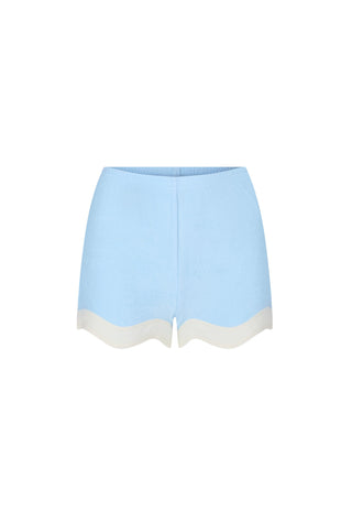 Light blue knit shorts with a scalloped cream-colored hem, shown flat against a plain white background.
